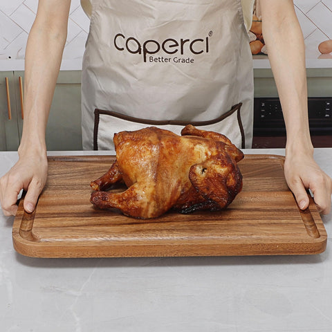 Caperci handled cutting board supports easy carrying from kitchen to table.