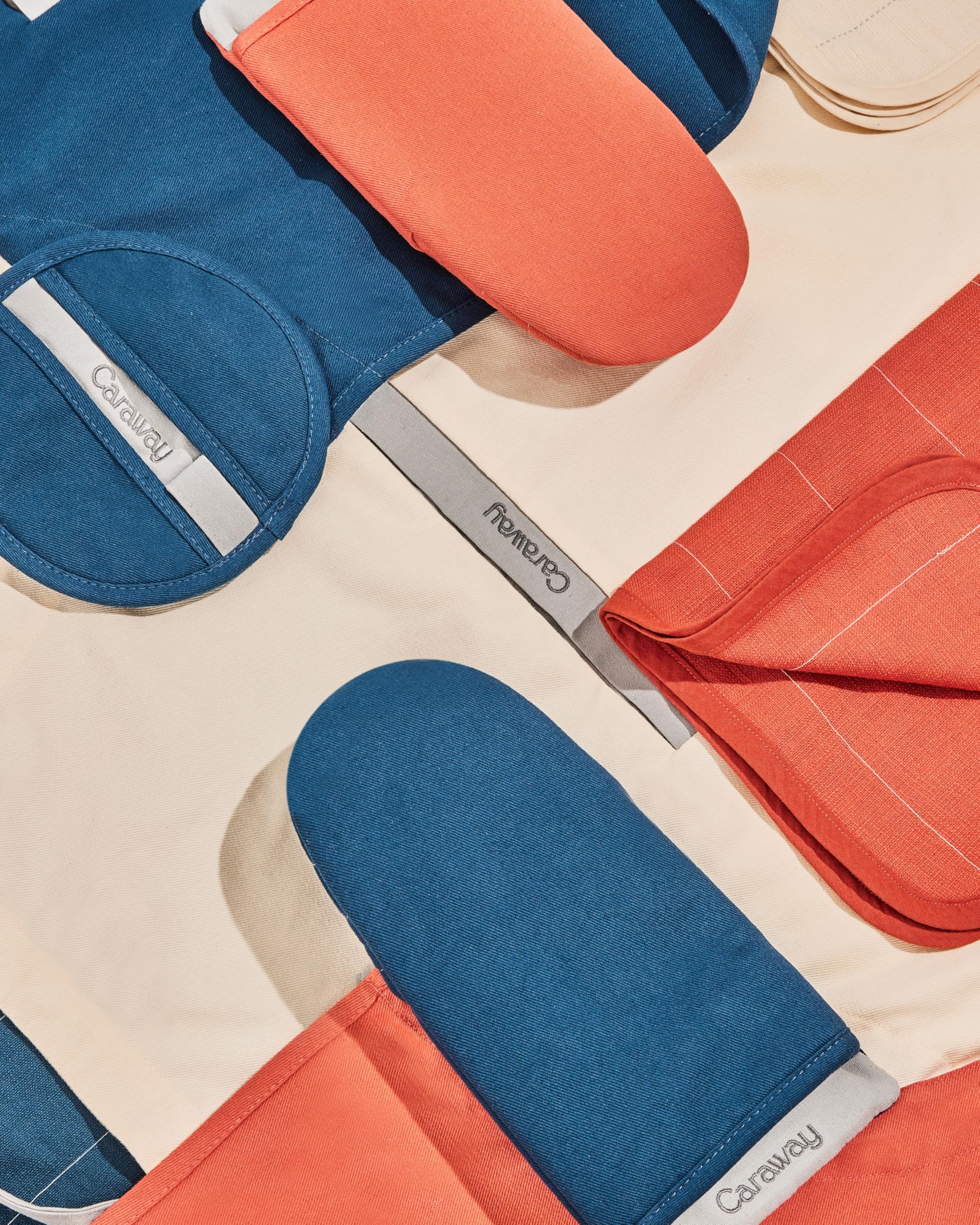 Caraway oven mitts coordinating-collection-cream pair helps maintain a cohesive kitchen look.