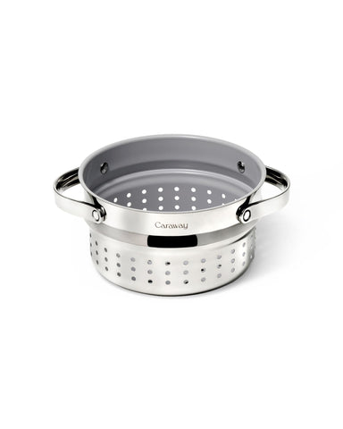Caraway Steamer small inside sauce pan demonstrates compact, even veggie steaming at home.