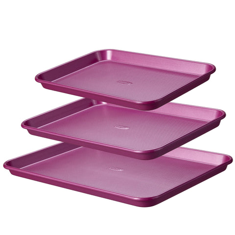 CAROTE 3-piece baking pan set stacked for compact storage.