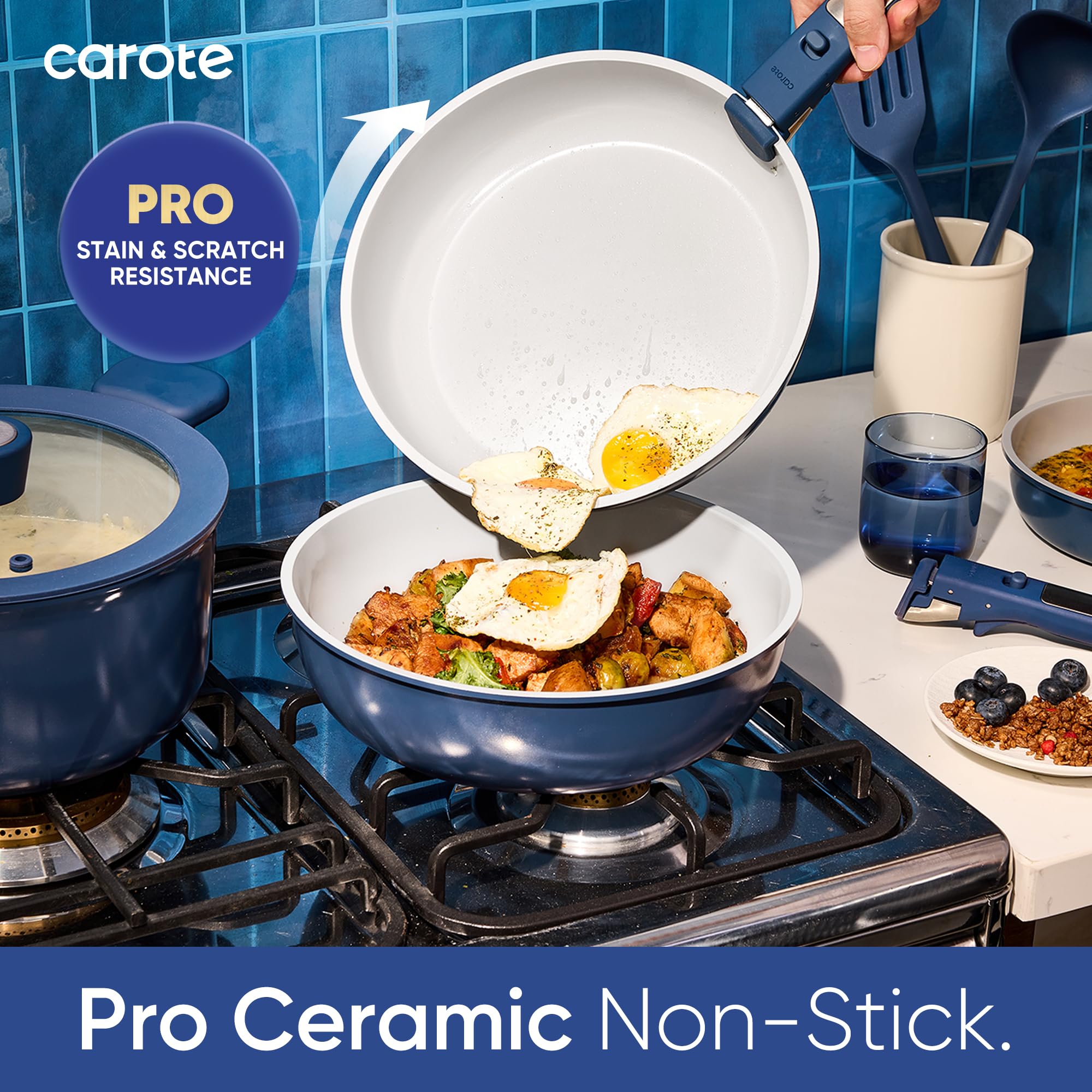 CAROTE navy blue cookware on a stove with lids, showcasing modern design.