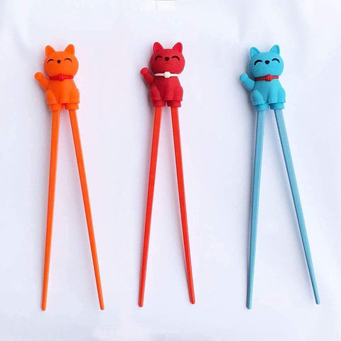Carykon training chopsticks holder demonstrates correct positioning for beginners.