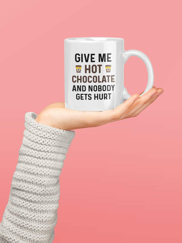 Casitika mug held by hands with steam inviting warm beverages.