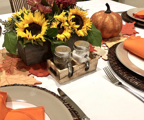 Solid wood caddy keeps jars organized and easy to move.