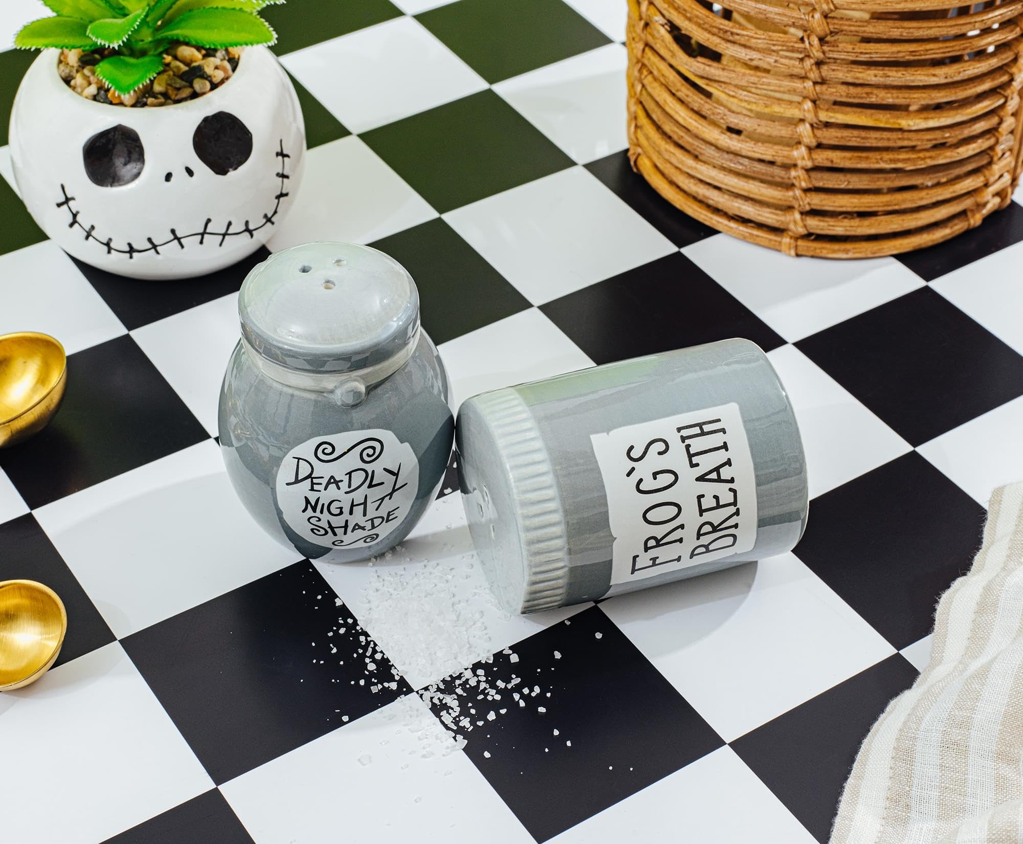 Ceramic salt and pepper shakers with Sally’s jar design for themed meals.