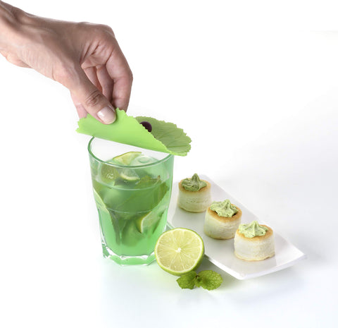 Charles Viancin grape drink cover on glass demonstrates reusable cooling and easy removal