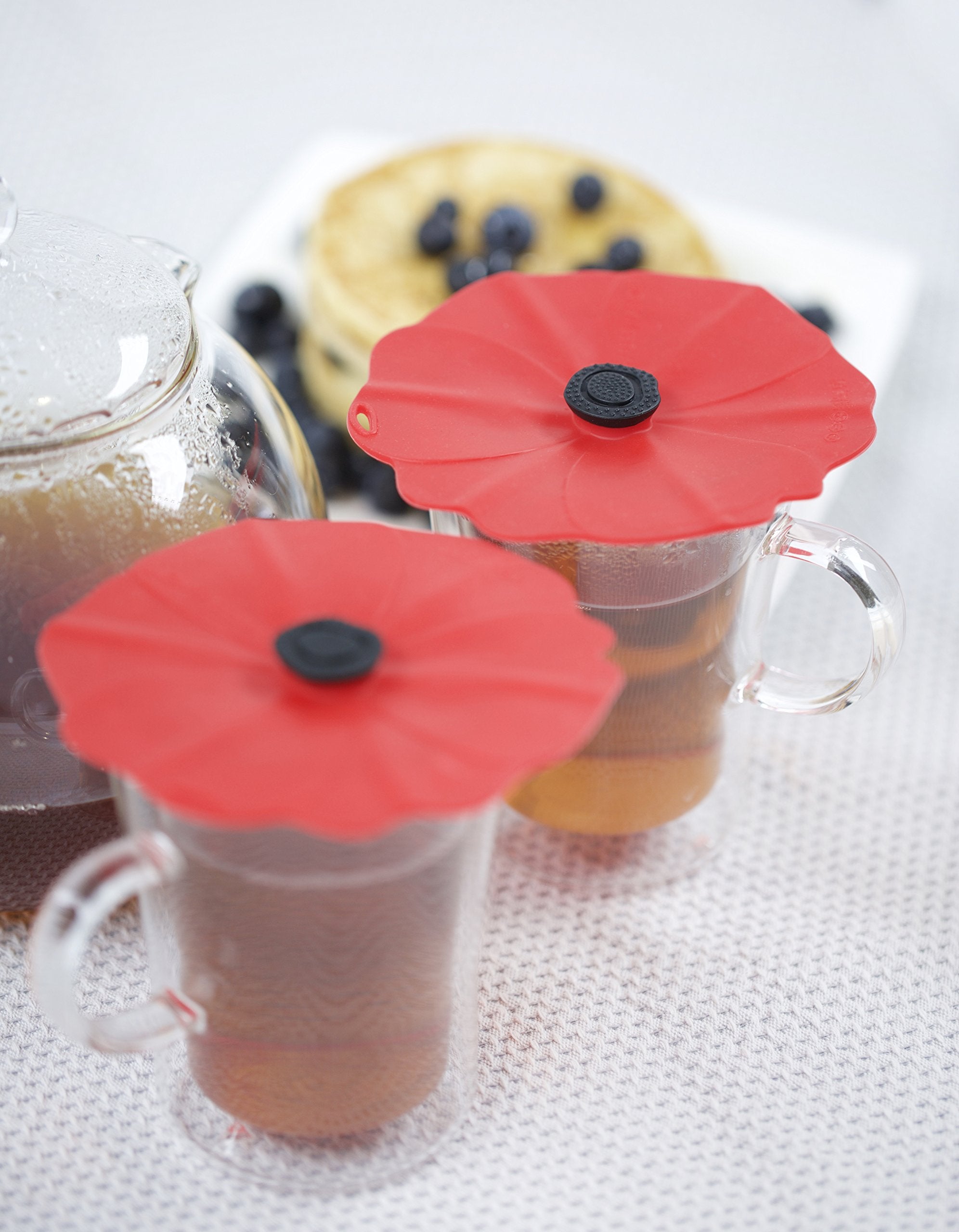 Charles Viancin Poppy lid on glass provides airtight cover for beverages.