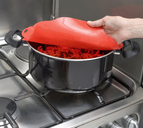 Charles Viancin Poppy lid on oven-safe dish preserves heat for cooking.