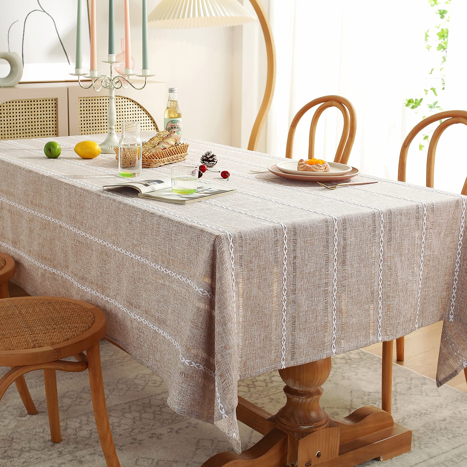 Chassic wrinkle-resistant polyester tablecloth with embroidery enhances dining appeal.
