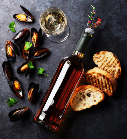 Cheers Rooster stopper on bottle demonstrates leak-proof, reusable design