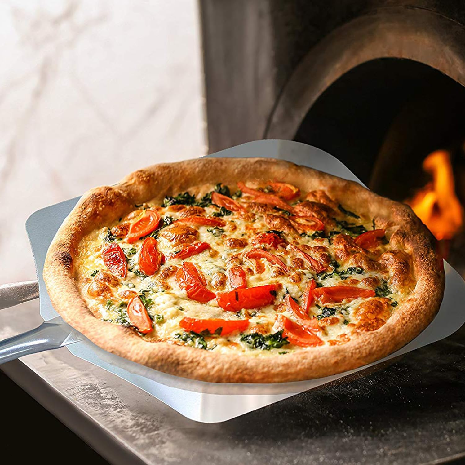 Chicago Brick Oven pizza peel includes leather strap for easy hanging