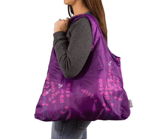 ChicoBag Vita Inspire Be in use with hands-free shopping design.