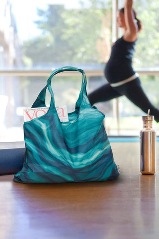 ChicoBag Vita tote in store checkout line, lightweight shopping solution