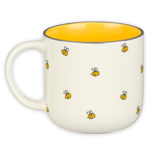 Christian Art Gifts Bumble Bee Mug held by hand showing a wide, comfortable handle