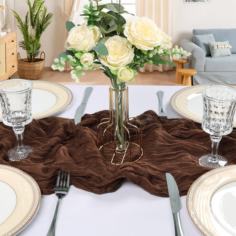 CKIKU brown cheesecloth runner at wedding arch showcases romantic gauze styling.