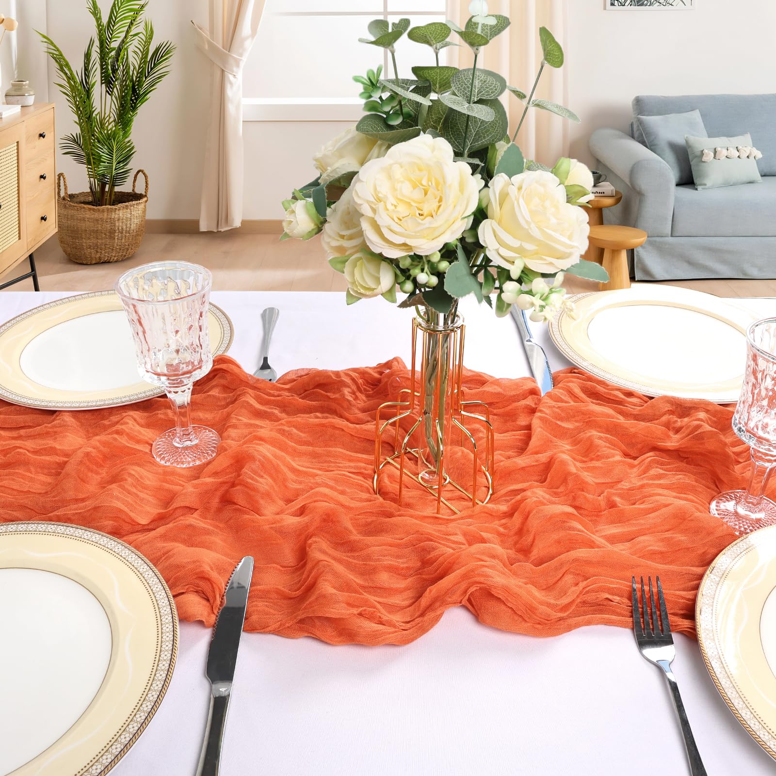 CKIKU wedding-arch orange table runner creates an elegant backdrop for photos