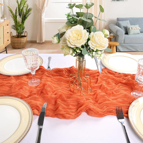 CKIKU wedding-arch orange table runner creates an elegant backdrop for photos