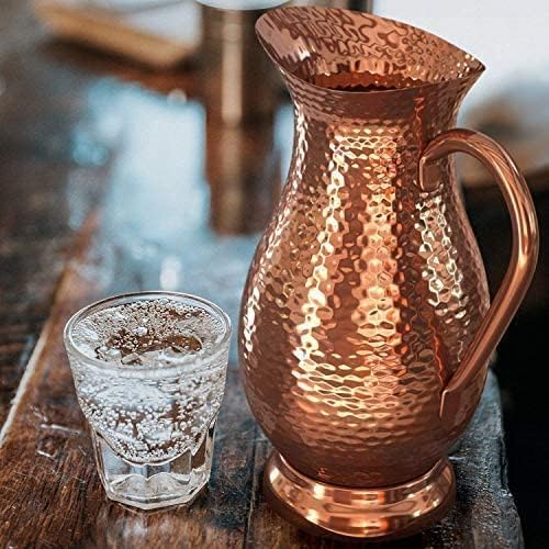 Classic Mules Copper Pitcher used as a vase adds warm metal accent.