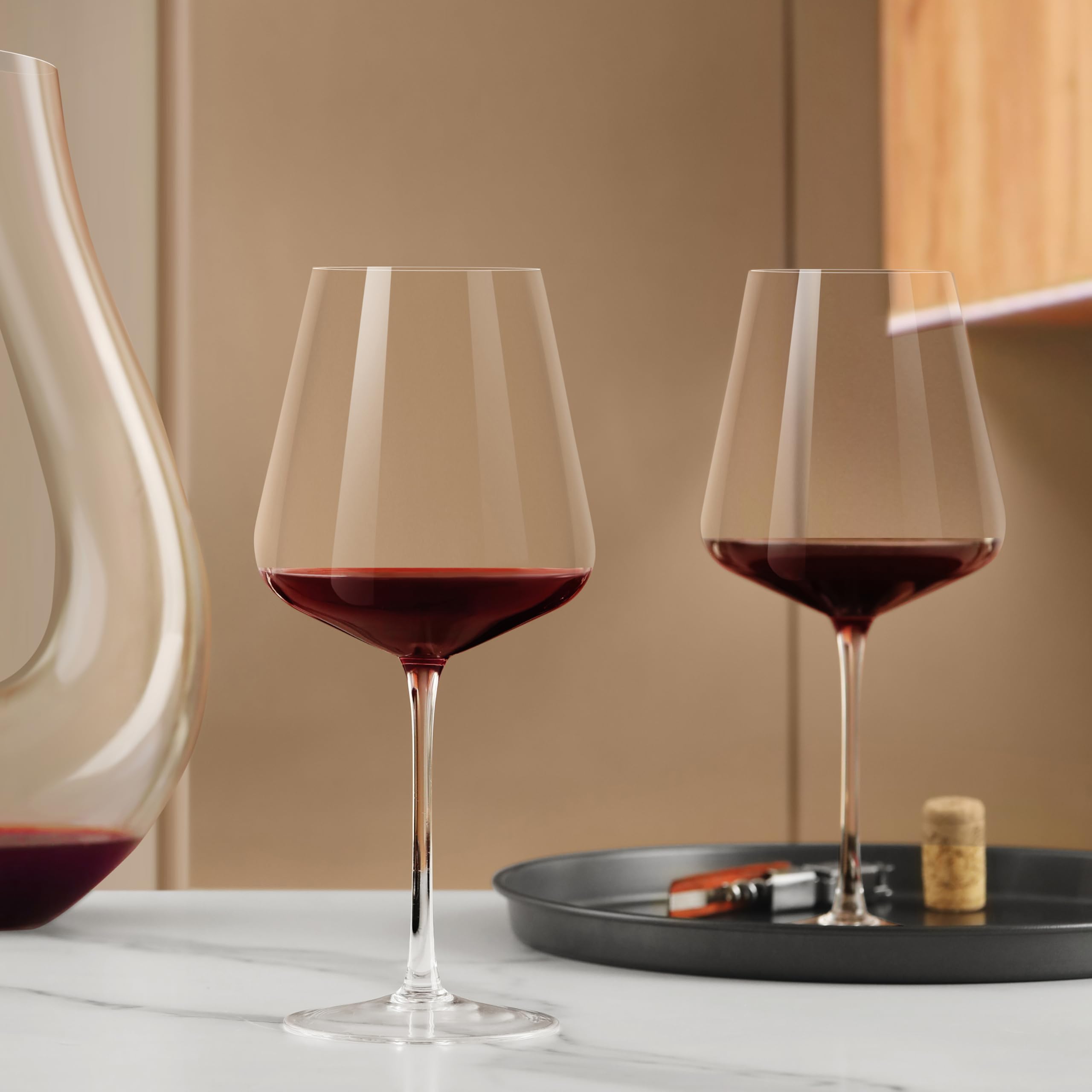 CnSneg red wine glass reveals deep color through wide mouth for aroma