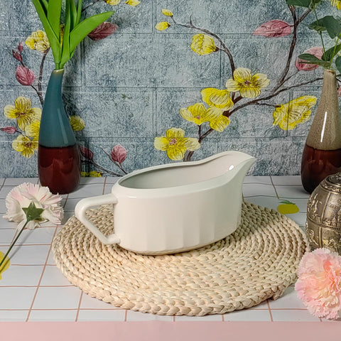 Cobata gravy boat used for dessert toppings like caramel or fudge