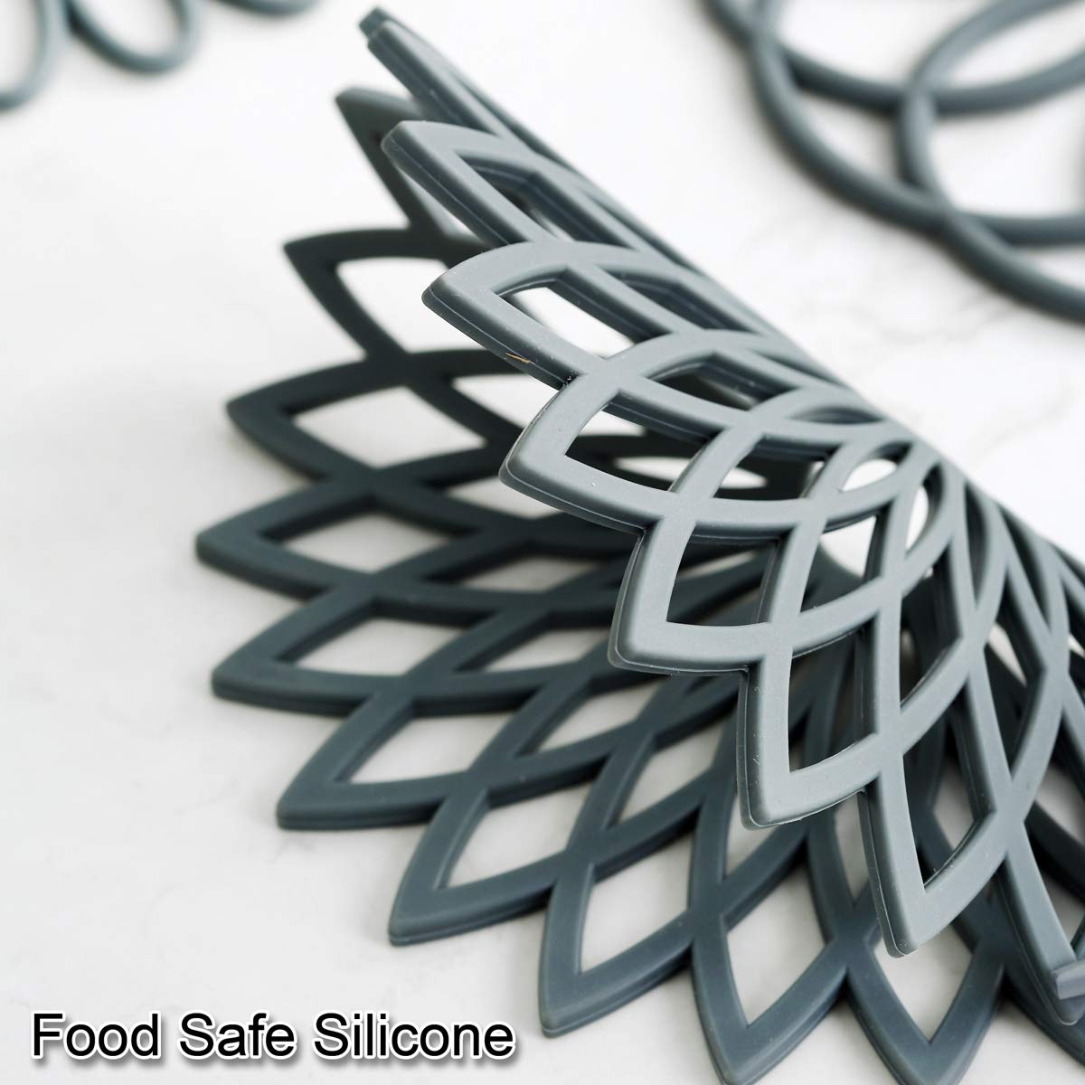 Colinda non-slip silicone trivet mat prevents slips when placing hot cookware.