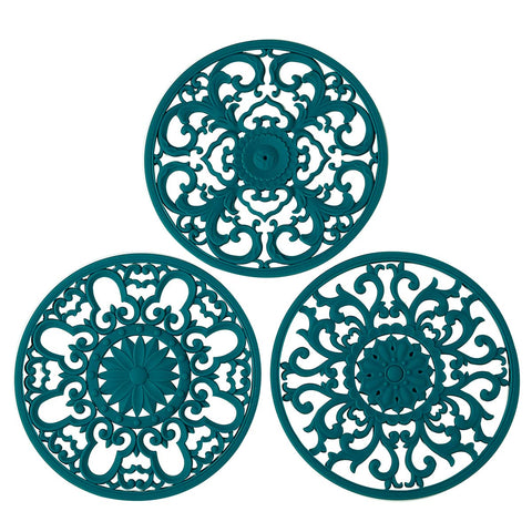 Colinda trivet teal set of 3 with decorative designs protecting countertops.