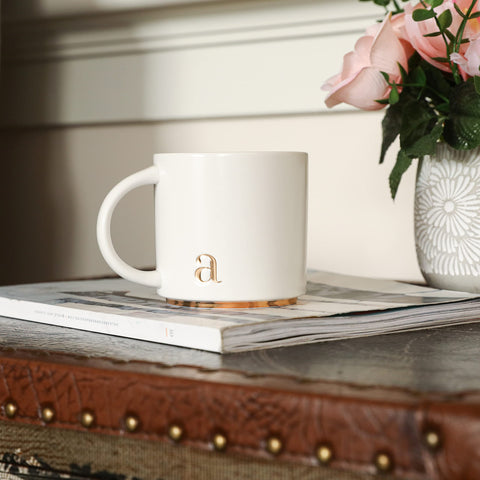 COLLECTIVE HOME ceramic mug with alphabet design in white, a chic desk companion.