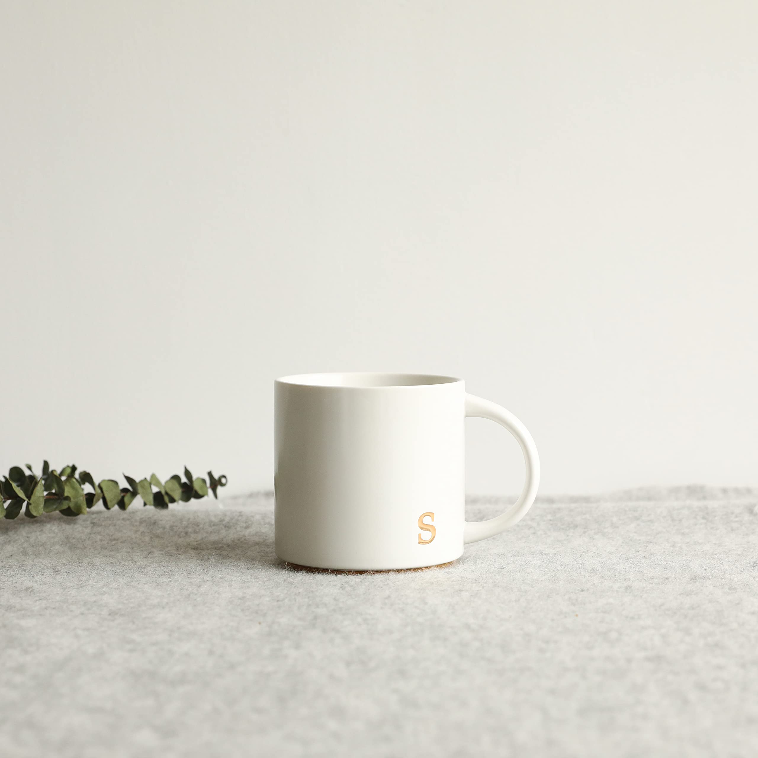 COLLECTIVE HOME sophisticated gold lettering enhances morning routine.