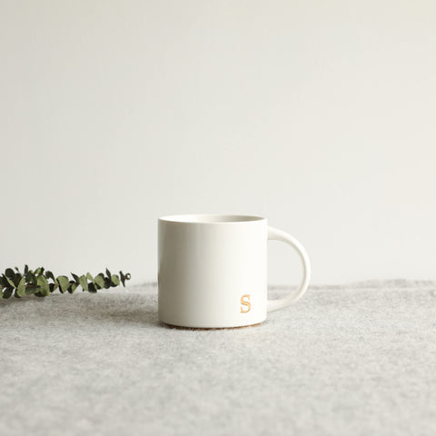 COLLECTIVE HOME sophisticated gold lettering enhances morning routine.