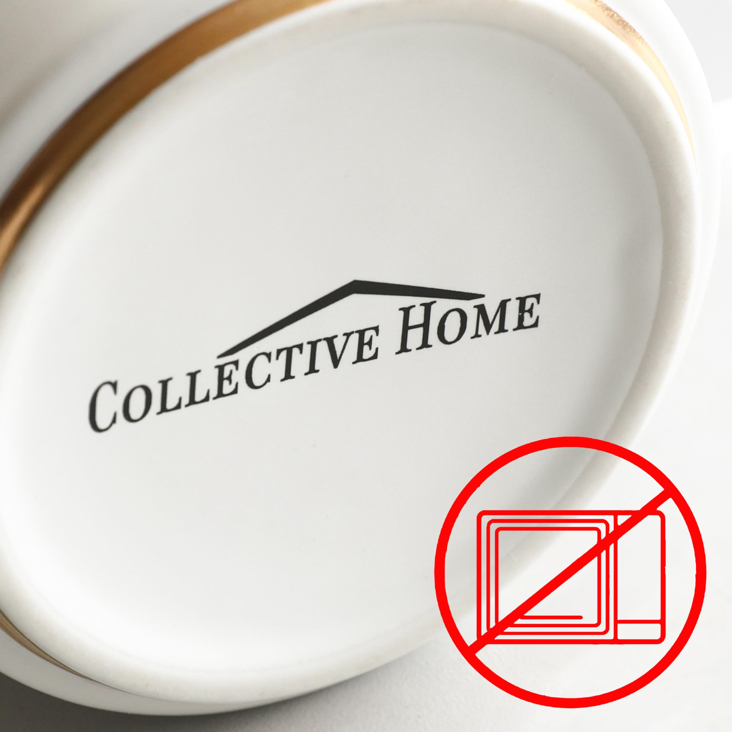 COLLECTIVE HOME mug features gold detailing; handle with care to maintain shine