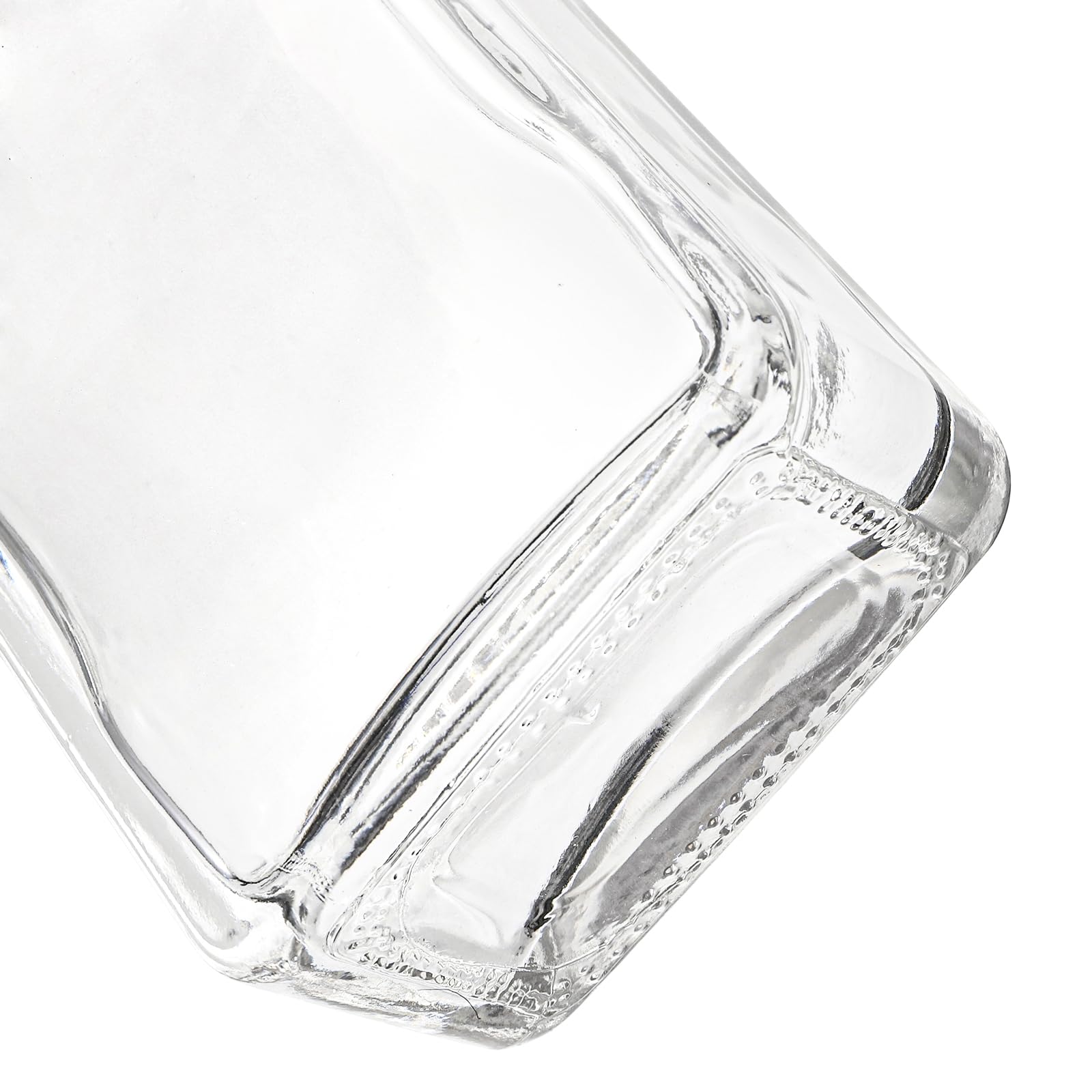 Coloch heavy base glass bottle emphasized for stability on home bars
