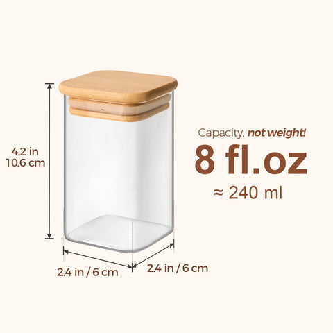 ComSaf square spice containers arranged in a cabinet.
