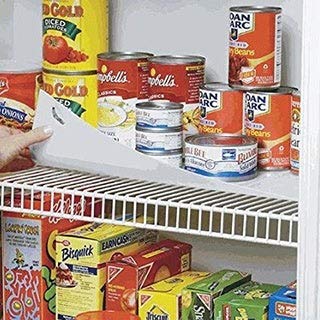 Conimar shelf liner installed in a cabinet prevents items from tipping.