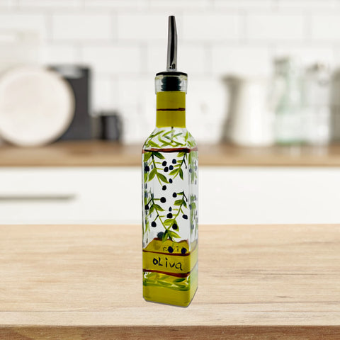 Oil and vinegar dispenser in use on table or counter.