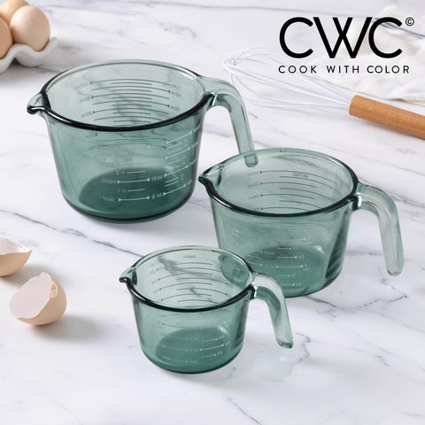 COOK WITH COLOR microwave-safe glass measuring cups for heating ingredients in the cup.