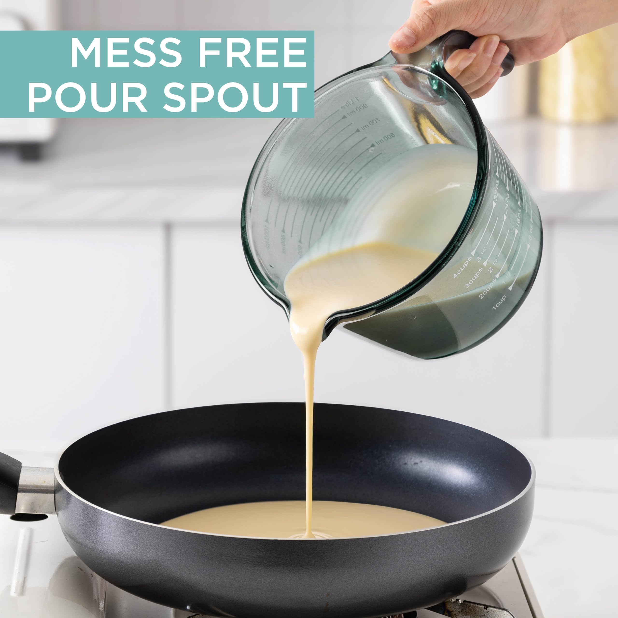COOK WITH COLOR green glass measuring cup highlights color for attractive kitchen use.