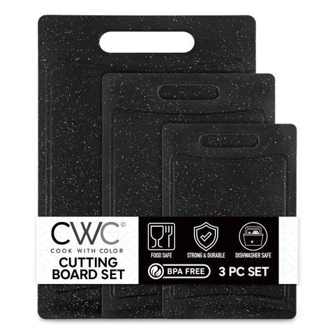 COOK WITH COLOR non-slip cutting board set in speckled black for stable slicing.