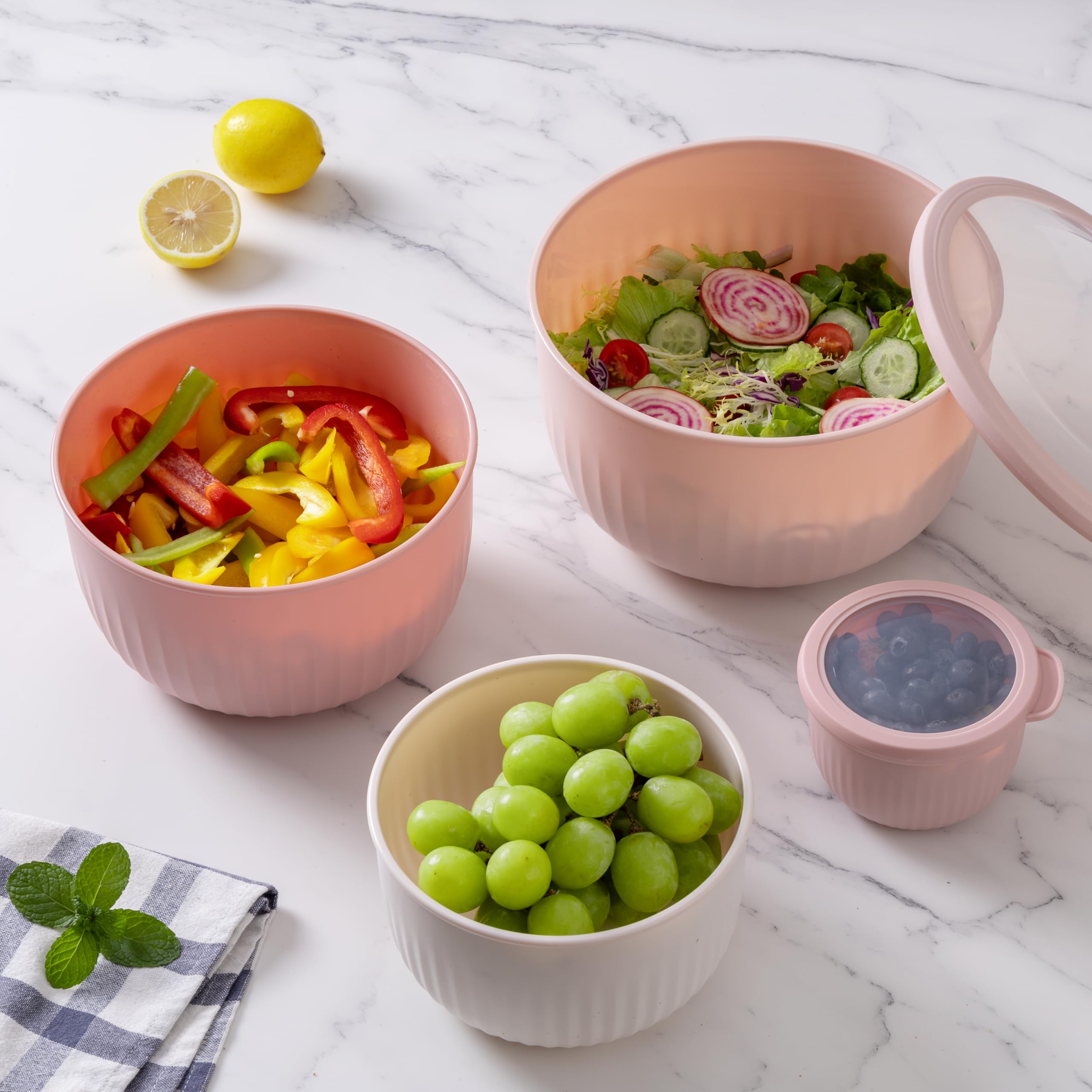 Cook with Color ombre pink bowls brighten kitchen tasks.