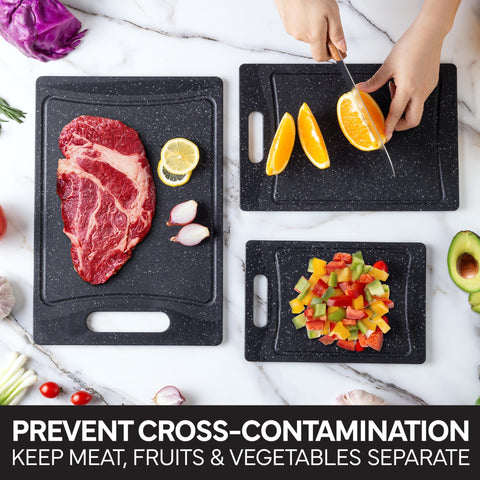 COOK WITH COLOR rubber feet keep boards secure during chopping.