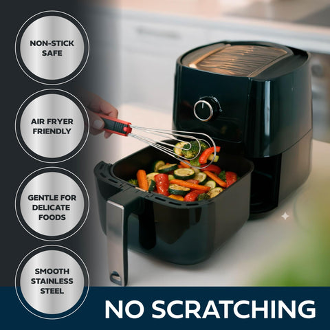 Cooks Innovations Foodie Tongs flexi-mesh conforms to food for secure turning.