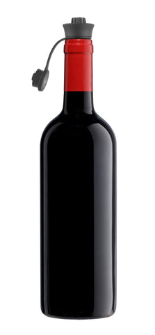 Coravin Pivot Stoppers in use pouring a glass while preserving remaining wine.