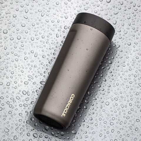 Corkcicle Commuter Cup on a bike cage during a ride.