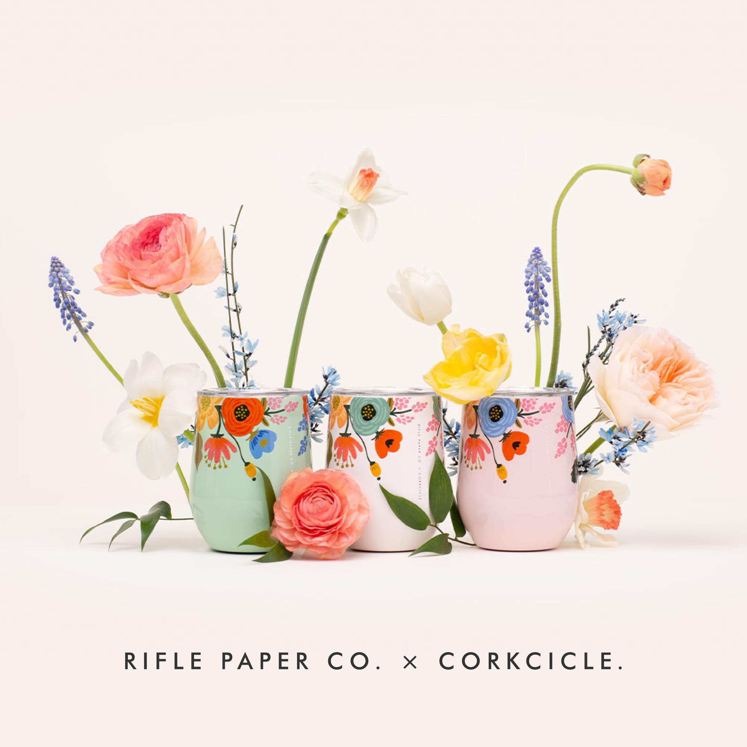Corkcicle 12oz blush lively floral pattern shines in warm lighting.