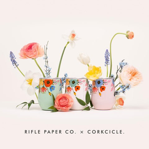 Corkcicle 12oz blush lively floral pattern shines in warm lighting.