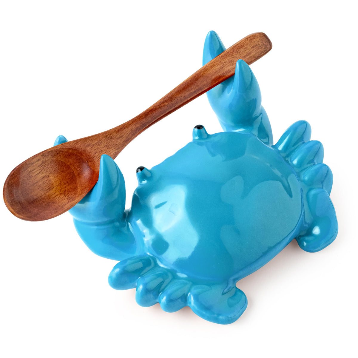 Cormomu blue ceramic crab spoon rest sits on stove, keeping spoons tidy for coffee moments