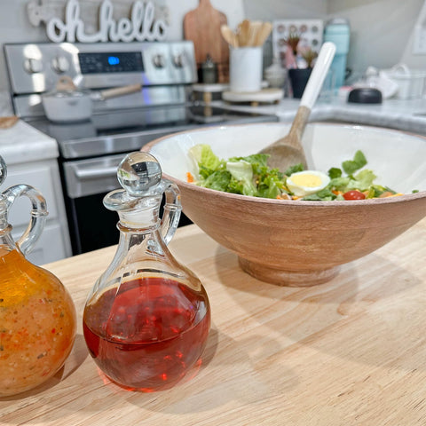 Cornucopia Brands clear glass bottles showcase oil color and viscosity on the kitchen shelf.
