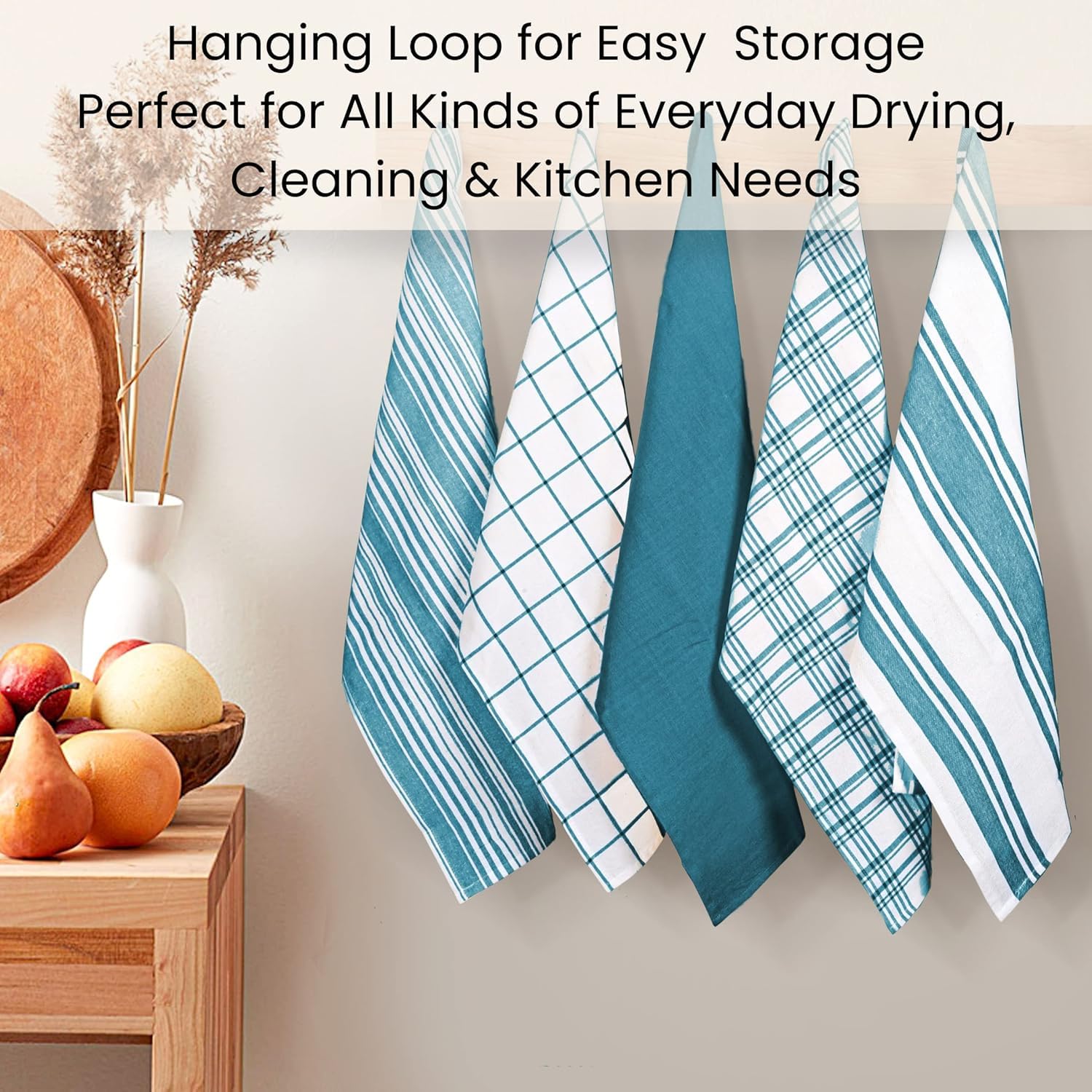 Cotton Clinic towels teal-green in kitchen setting for eco-friendly cleaning.