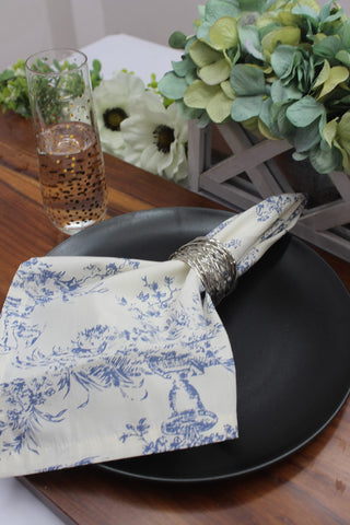 COTTON CRAFT table-setting napkin in navy toile, adds refined texture to gatherings.