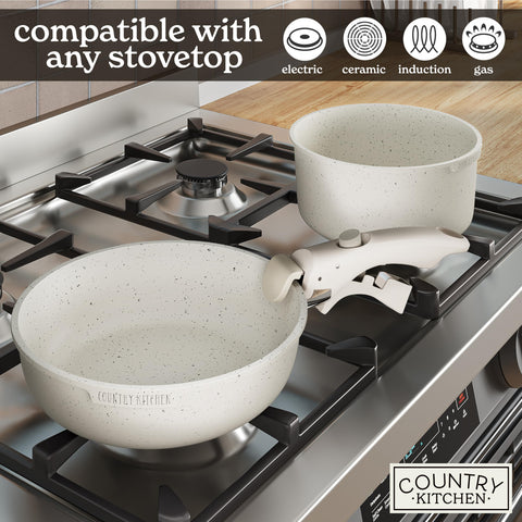 Country Kitchen cream-color cookware enhances warm kitchen aesthetics.