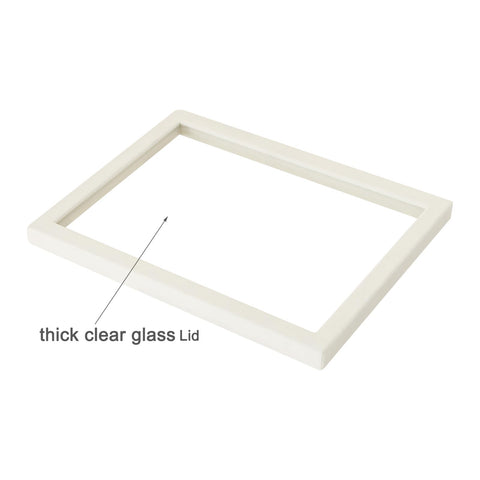 Coward beige velvet glass lid on a tray for organized storage and visibility.